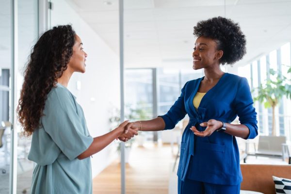 Diverse African professionals collaborating in a modern office, representing Employer of Record services for hiring employees across Africa.